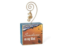 Load image into Gallery viewer, Photo Block Clip with Seahorse Charm & "Seashores on my mind" Wood Grain